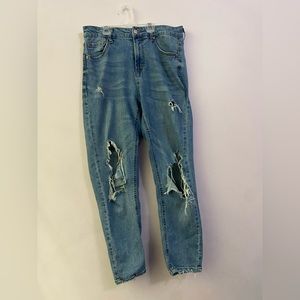 straight leg jeans, medium wash, medium rise, rips on knee on knee and calf